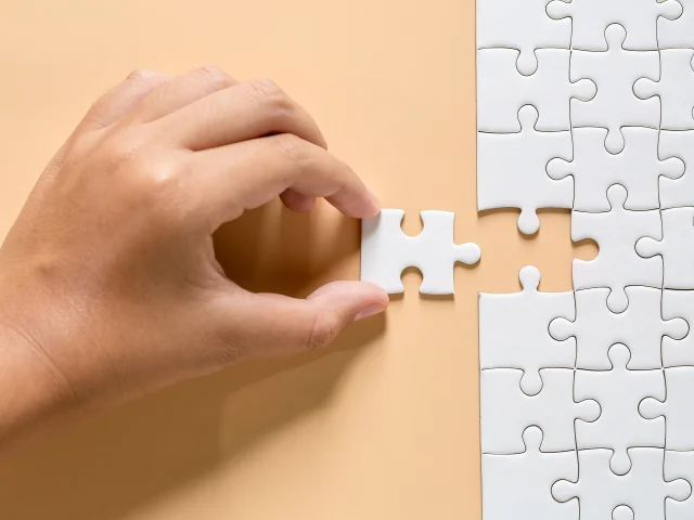 Orange floor made from white puzzle pieces and of piece puzzle paper cut this